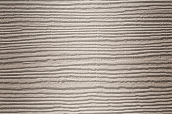 La couleur Pierre des Champs de la lame en ciment composite Hardie® Plank avec un aspect Cedar (aspect bois)